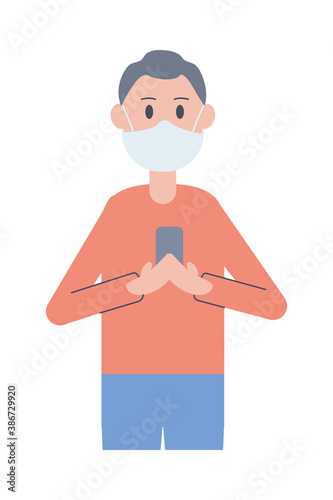 young man wearing face mask using smartphone