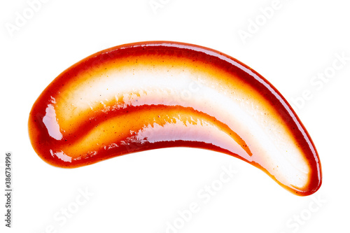 Close up of smeared drop of barbecue sauce or ketchup isolated on white background with clipping path. Top view.