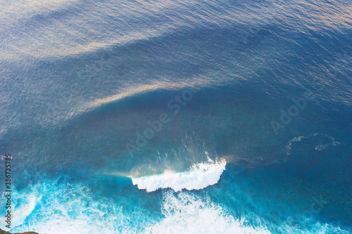 Aerial view ocean wave back...