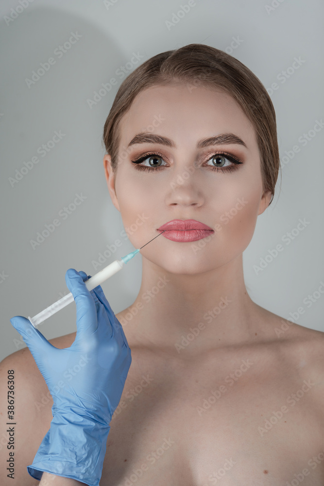 Cosmetic Treatment. Closeup Girls Hands Doing Facial Skin Lifting Injection To Woman's Face. Cosmetic Treatment. Closeup Girls Hands Doing Facial Skin Lifting Injection To Woman's Face.