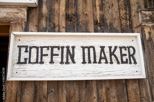 Old fashioned sign for a Coffin Maker, made of wood. Taken in Fairplay, Colorado