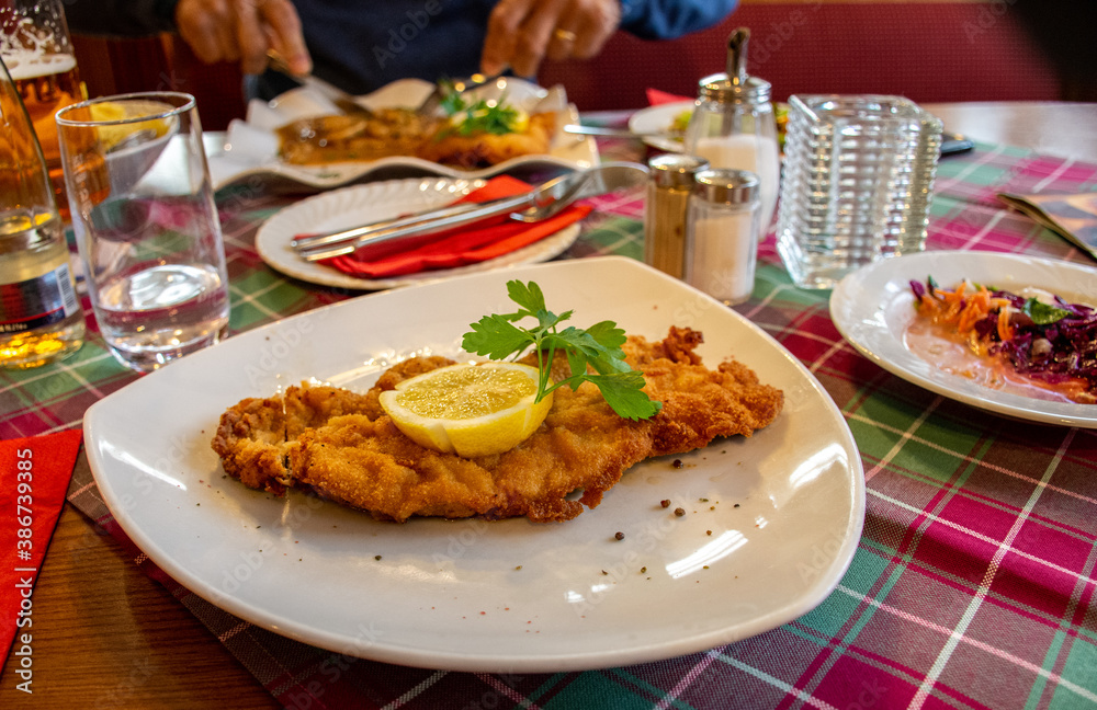 'Wiener schnitzel' a typical national dish of breaded veal from the austrian cuisine
'Wiener schnitzel' a typical national dish of breaded veal from the austrian cuisine