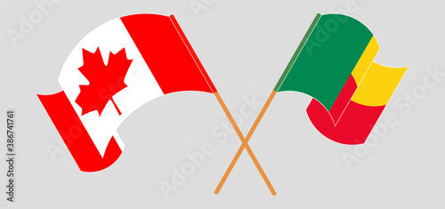 Crossed and waving flags of Benin and Canada