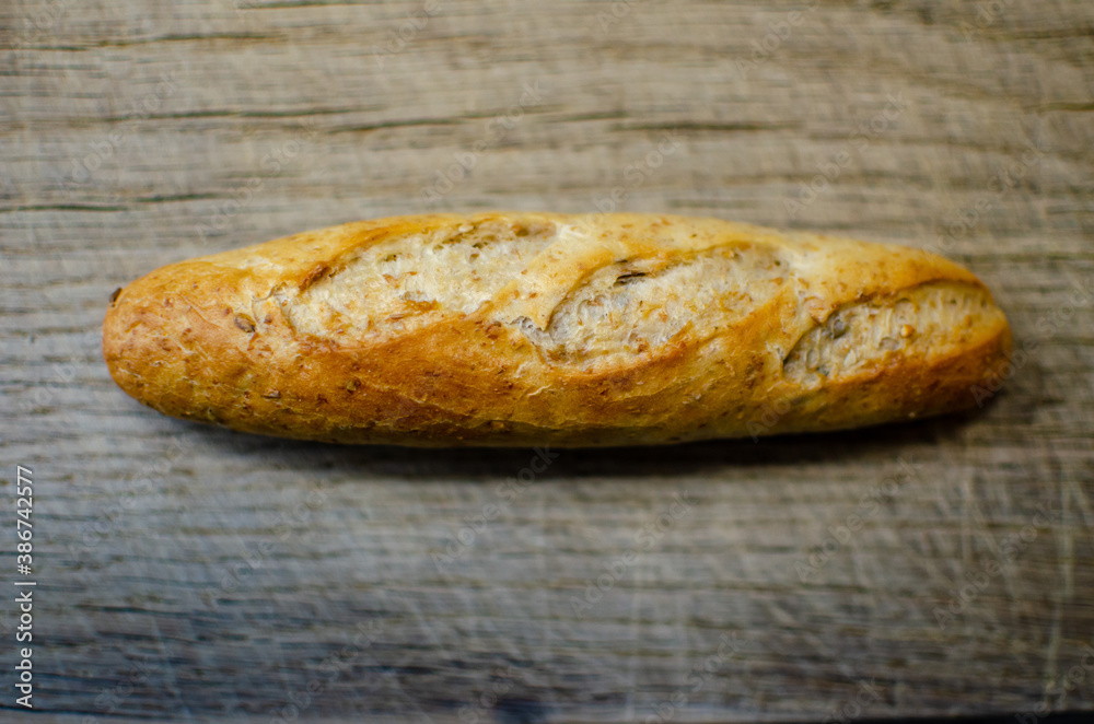 freshly baked bread on an oak cutting board