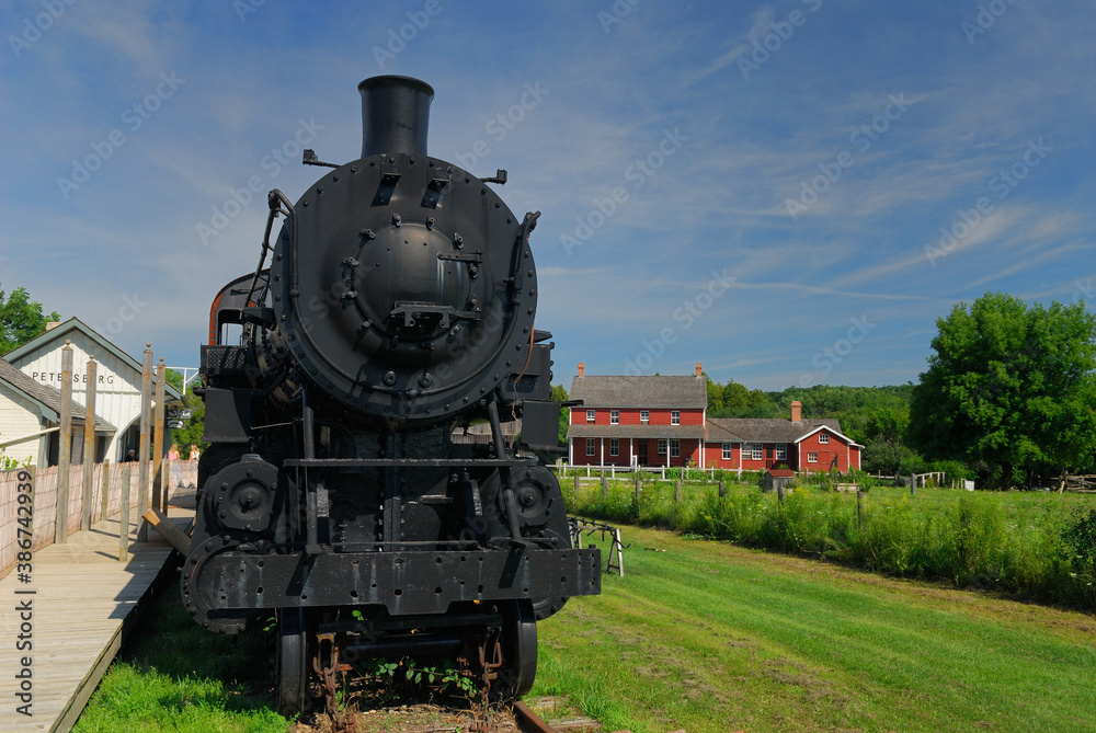 Naklejka premium Doon Heritage Crossroads Steam engine train and Mennonite house Kitchener, Ontario, Canada - August 6, 2006
