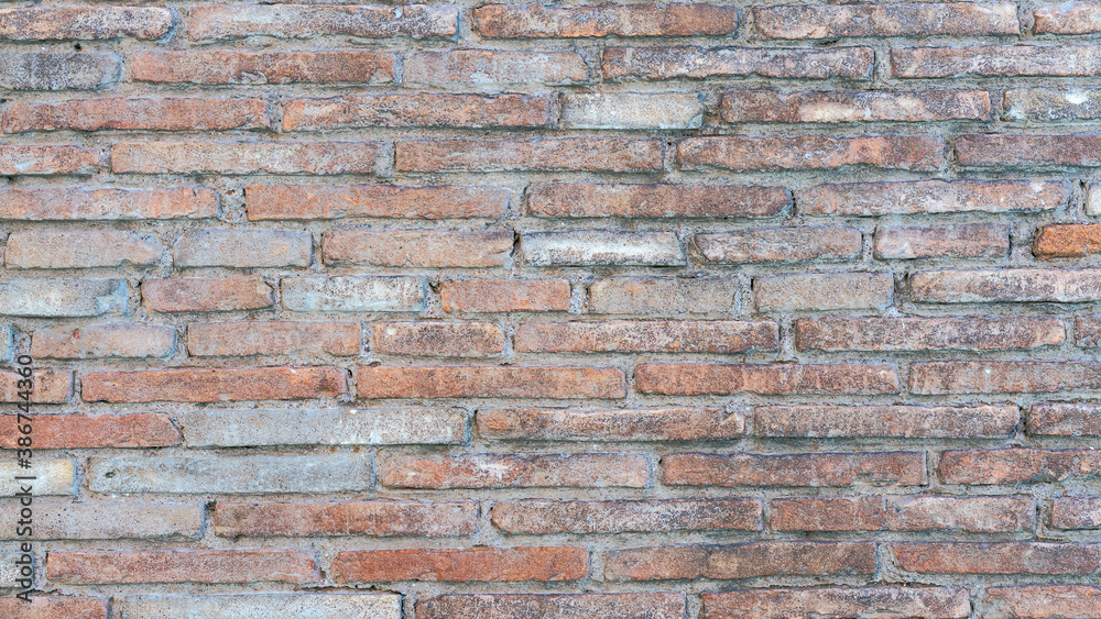 Fototapeta premium old brick wall of bricks of different sizes as background