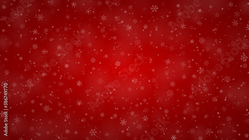 Christmas background of snowflakes of different shapes, sizes and transparency in red colors