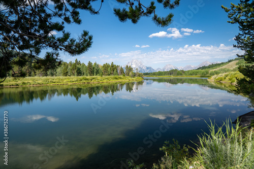 Daytime, sunshine view of the Grand Tetons from Oxbow Bend and the Snake River