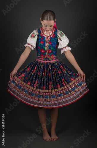 portrait of the beautiful young woman in traditional slovak folk dress