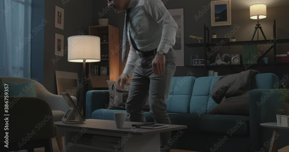 Businessman coming back home from work at night