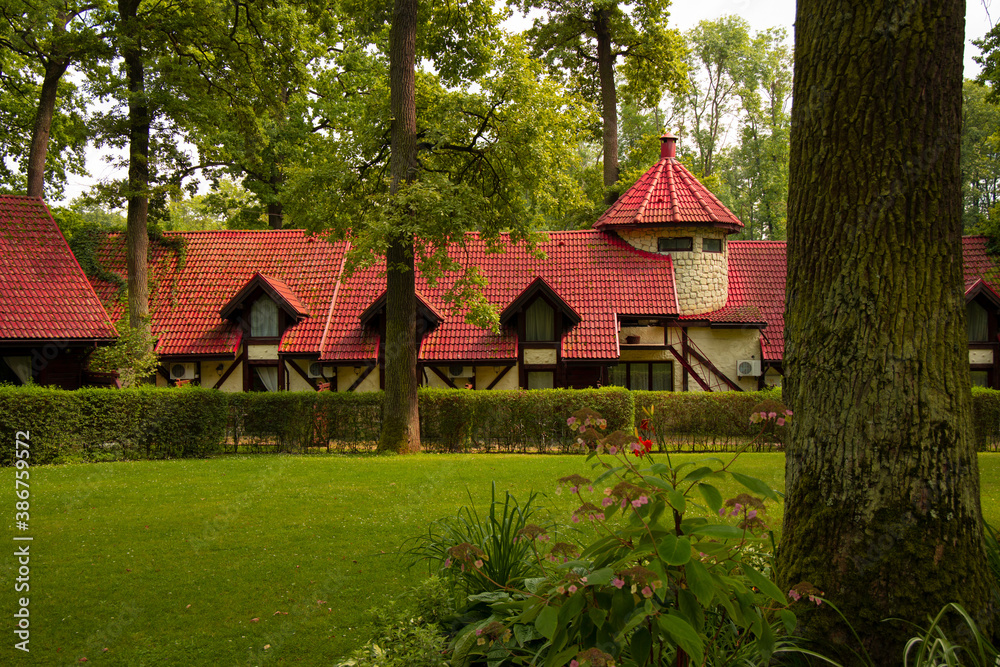 Fototapeta premium fairy tale cottage house in forest wood land landscaping garden peaceful nature environment space beautiful architecture object scenery