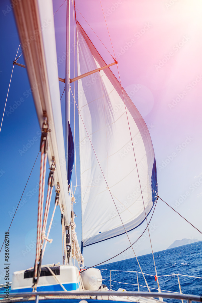 Fototapeta premium Sailing. Ship yachts with white sails in the open Sea.