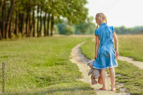Bilde på lerret Happy child playing in nature in summer