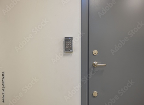 Canvastavla View of grey metal door with digital code lock. Security concept.
