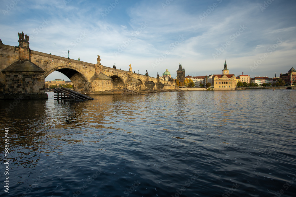 Fototapeta premium panoramic view of Charles Bridge and the Vltava River. stone bridges on the river in the city. in the center of the old town of Prague in the Czech Republic