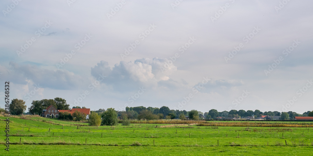 Old farmhouse standing in polder