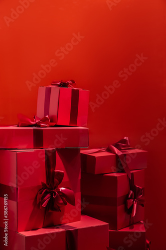 Gift boxes with a bow on a red background.