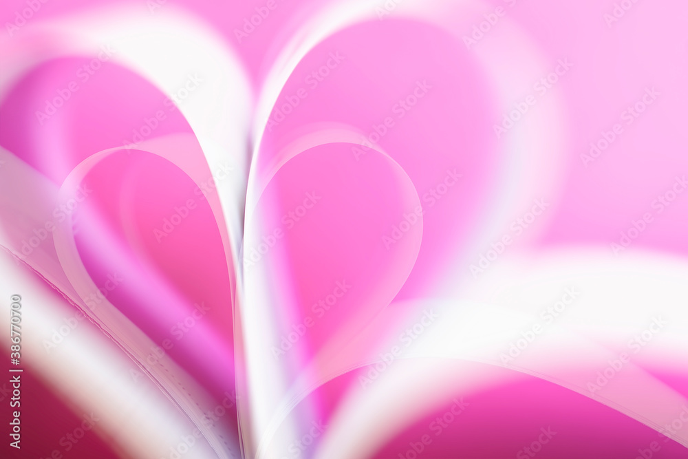 Blurred pink gentle background with hearts shaped paper pages, love and Valentine's day concept, selective focus Blurred pink gentle background with hearts shaped paper pages, love and Valentine's day concept, selective focus