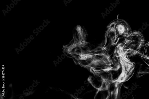 Fototapeta Naklejka Na Ścianę i Meble -  White natural steam smoke effect on solid black background with abstract blur motion wave swirl use for overlay in vapor cigarette, hot boil food and water