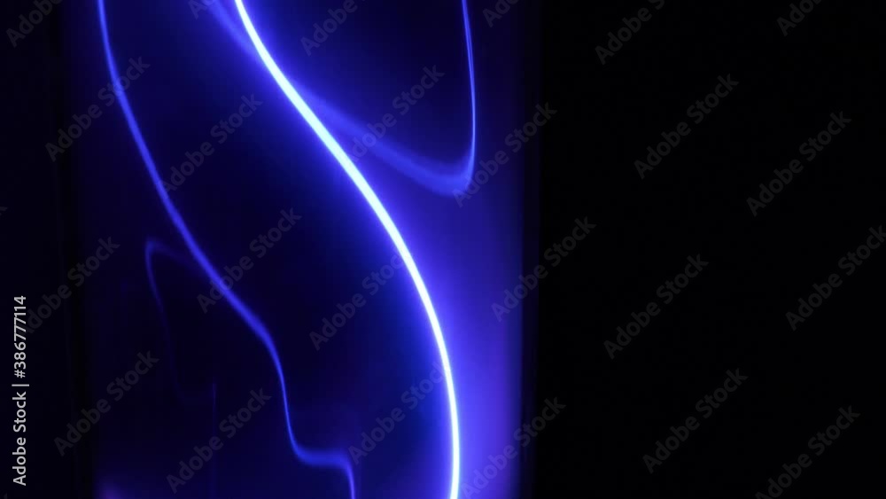 Energy blue lightning a glowing loop plasma background, loped. The theme of controlled electric high-power energy and current discharges by Tesla. Small lightning bolts on the isolated dark. Energy blue lightning a glowing loop plasma background, loped. The theme of controlled electric high-power energy and current discharges by Tesla. Small lightning bolts on the isolated dark.