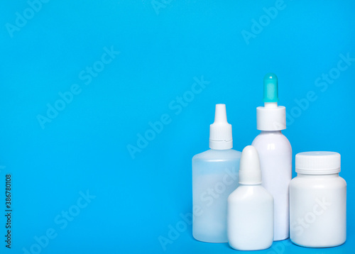 Bottle mockup on blue background. Bottle, container from pills, capsules.