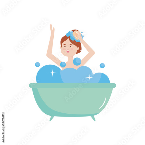 happy young woman in the bathtub with bubbles