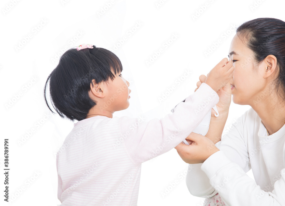 Daughter and mother are analyzing how to wear masks Daughter and mother are analyzing how to wear masks