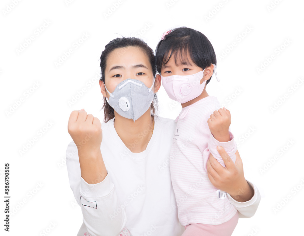 Mother and daughter wearing masks make cheering gestures together