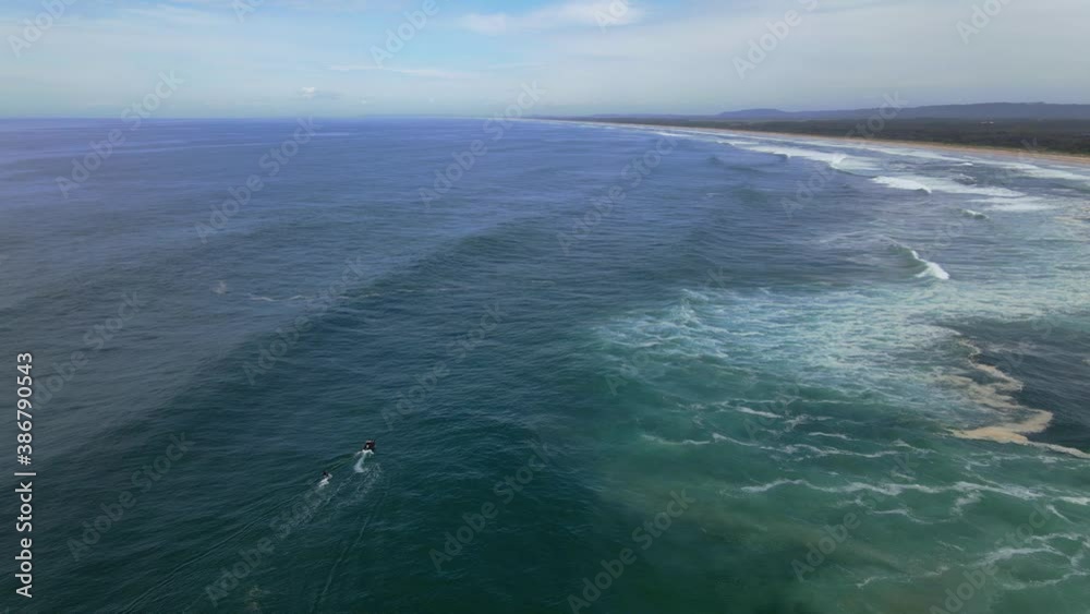 Wake boarding -perfect waves of Sharpes Beach -Australia -Aerial Wake boarding -perfect waves of Sharpes Beach -Australia -Aerial