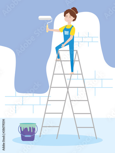 young woman on ladder wall paint with roller and bucket remodeling
