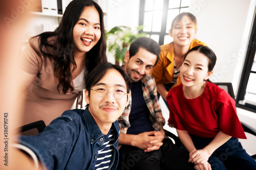 Selfie of group young man and woman team smiling having fun together