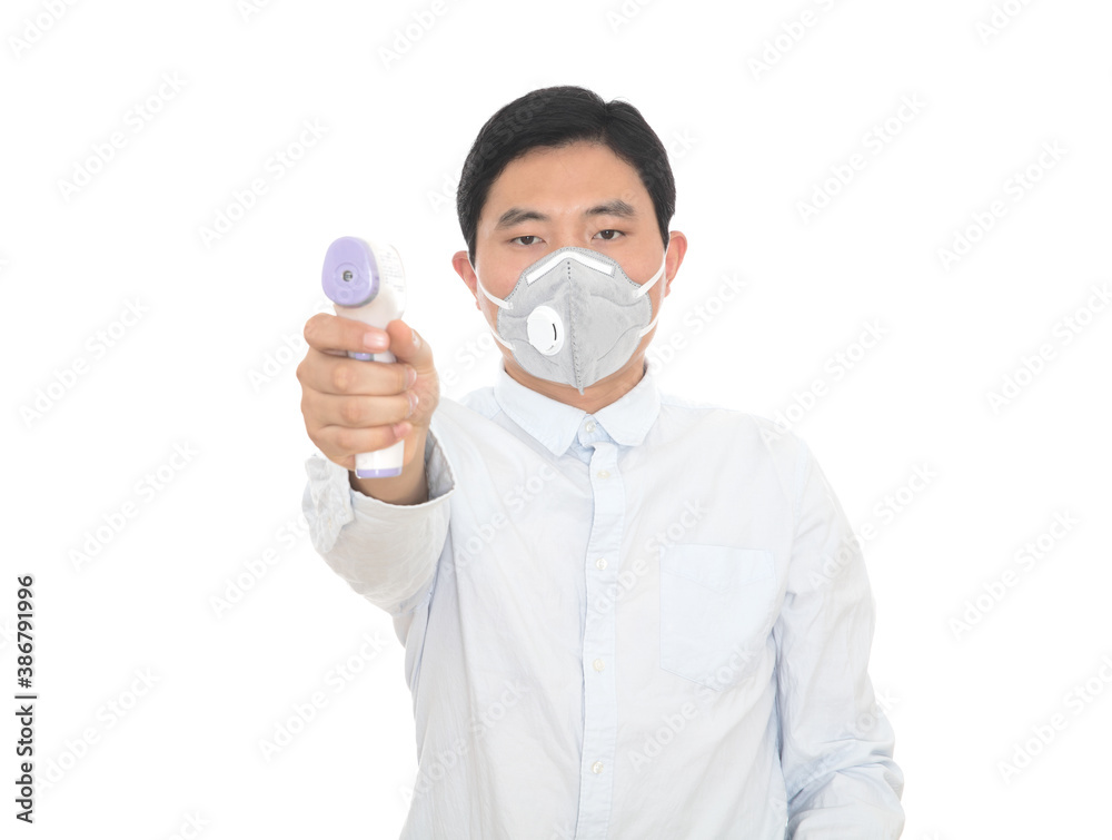 Men wearing masks holding infrared thermometers Men wearing masks holding infrared thermometers