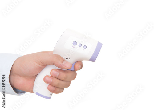 Shooting hands holding infrared thermometer in front of white background