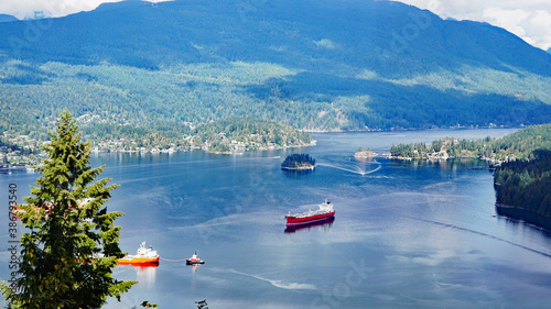 Oil tankers moored at pristine Burrard Inlet near Port Moody, BC, Canada