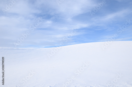 Cold Cirrus Clouds in an otherwise Blue Sky over a Snow Covered Countryside in the Palouse of Eastern Washington State, USA  © David Williamson