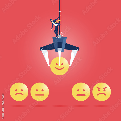 Consumer feedback Concept-Emotional feedback with emoticons, Customer selected happy doll face with grabber machine, make a review or feedback of the quality of service