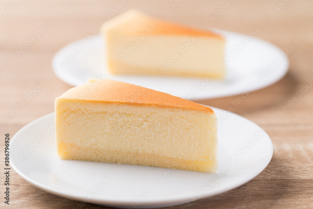Slice of vanilla cheesecake on white plate