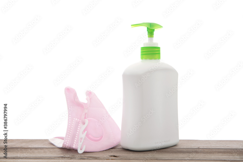 A bottle of detergent and an N95 mask A bottle of detergent and an N95 mask