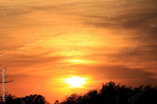 sunset over the field in Kansas out in the country. © Stockphotoman