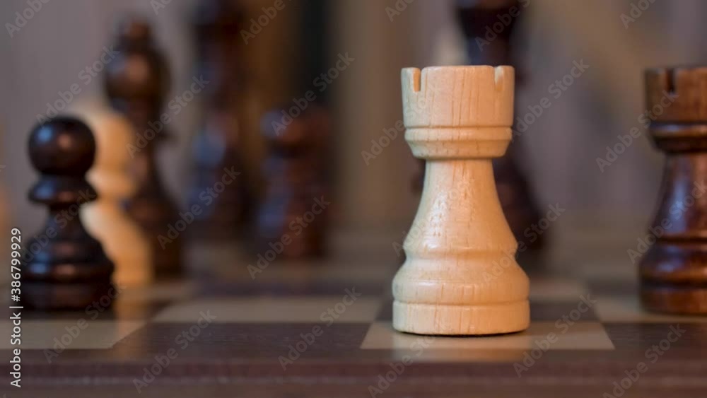 White Bishop Takes Pawn In Chess Match - close up shot White Bishop Takes Pawn In Chess Match - close up shot