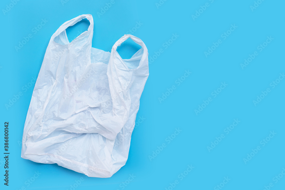 White plastic bag on blue background. White plastic bag on blue background.