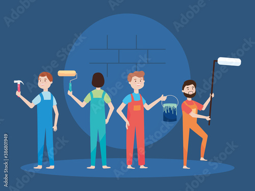 people workers with paint roller brush bucket and hammer remodeling