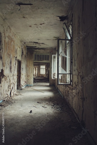 Passage in a decaying building  warm tones