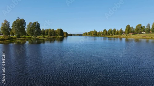 Calm River And Green Landscape Of Dalarna, Sweden - Aerial moving shot photo