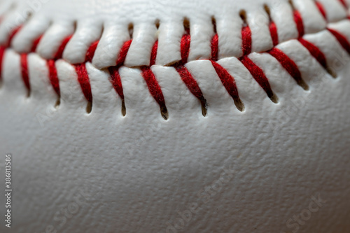 Close up of red stiches of a baseball