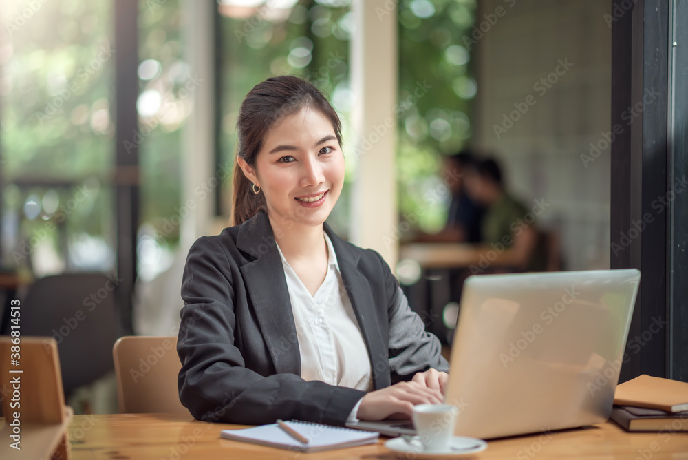 Young pretty asian businesswoman with laptop computer in the office. Young pretty asian businesswoman with laptop computer in the office.