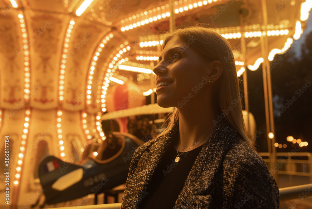 Beautiful smiling tourist woman having fun at amusement park at summer day trip. Beautiful smiling tourist woman having fun at amusement park at summer day trip.