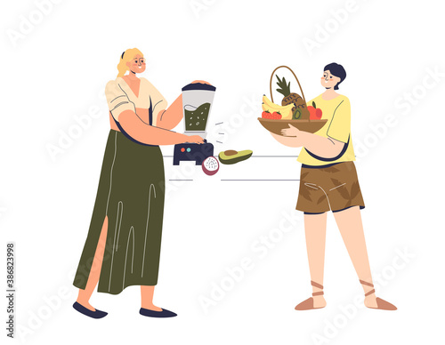 Young couple making fresh smoothie drinks of organic fruits and vegetables