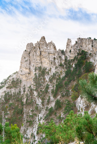 Ai-Petri mountain on the Crimean Peninsula on the Black sea coast. Mountain landscape on the seashore against the blue sky on a sunny day. The nature of Crimea.