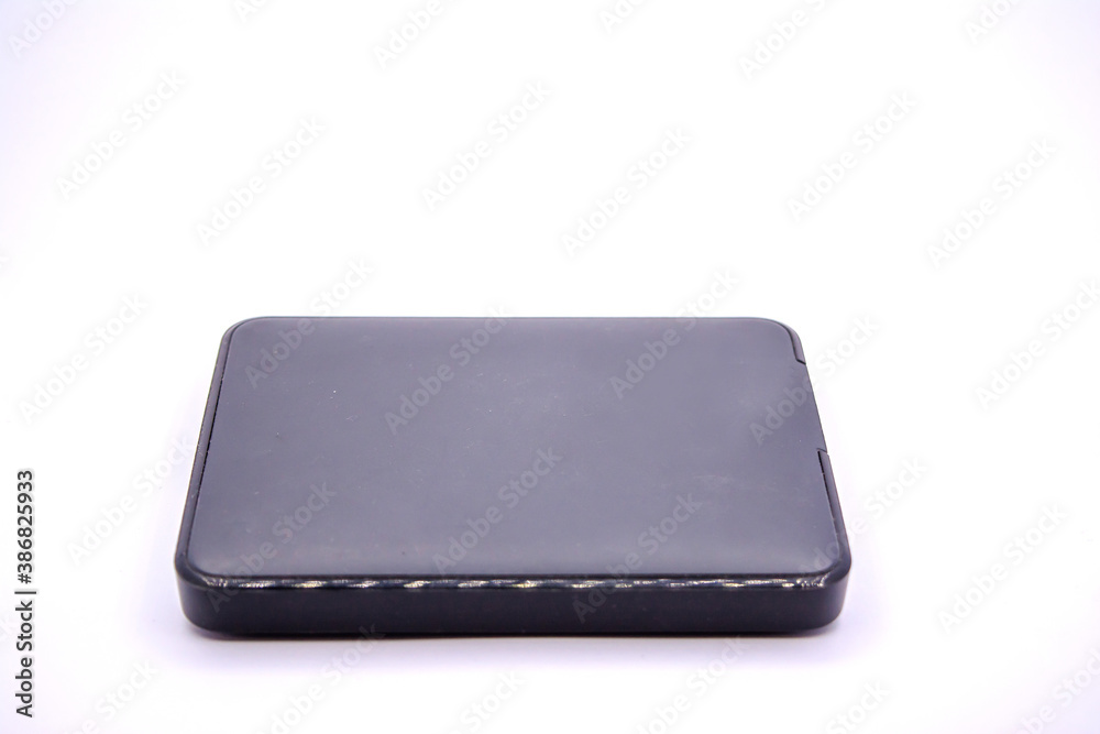 HDD - Grey Portable External Hard Disk Drive isolated on white background. External hard disk drives. HDD - Grey Portable External Hard Disk Drive isolated on white background. External hard disk drives.